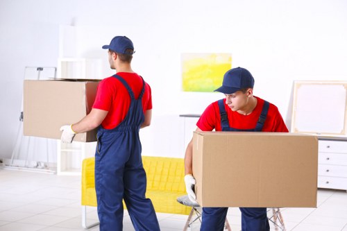 Man with van loading items for a Upton Park local move
