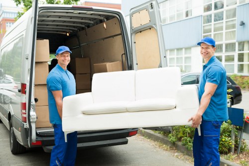 Removal van and moving boxes in a Upton Park residential street