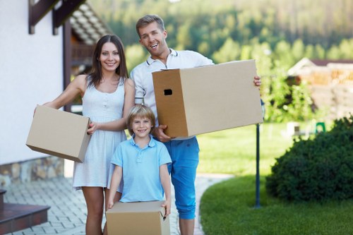 Local house removals service handling furniture in a flat or terrace home